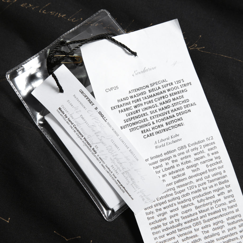 Geoffrey B.Small ジェフリー ビースモール / 24AW 美品 HUSE 別注 / advanced drop-crotch tailored cargo pocket trouser / Biella 100% wool Tasmania 120'sカーゴパンツ / size 42  (hand wash dark grey w/blue & purple stripe)